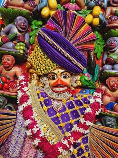 an elaborately decorated statue with many colorful decorations