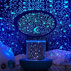 a room with stars and moon lights on the ceiling