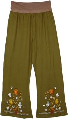 A funky 70`s style pants in cotton sinker fabric, with beautiful herbs embroidered in the bottom. These cotton pants feature a flexible and comfortable yoga waist, they drape in a slight bell-bottom style. #tlb #SplitSkirtsPants #Patchwork #Embroidered #bohemianfashion #Handmade #BohemianPants #FallPants #PatchworkPants #HippieCottonPants Green Clothing, 70’s Style, Bohemian Pants, Fall Pants, Hippie Look, Bohemian Handmade, Trendy Skirts, Split Skirt, Boho Pants