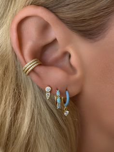 These huggie earrings feature a 9.5mm inner diameter and three stunning genuine opal stones measuring 4x2mm each. Add a touch of luxury to any outfit and enjoy the natural beauty and unique properties of genuine opal. Stone: Cubic Zirconia & OpalMaterials: Sterling Silver & 14K Gold Vermeil Earring Trends, Earring Bundle, Pearl Collection, Vermeil Jewelry, Demi Fine Jewelry, Opal Stone, Huggie Earrings, Cz Diamond, Fine Jewellery Earrings