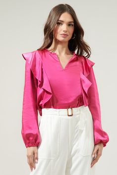 This is your sign to get the satin top of your dreams. Features a classy silhouette with a ruffle trim split neckline. Flouncy ruffle details flow from shoulder to the bottom of the blouse, framing long balloon sleeves.- Satin- Ruffle details- Split neckline- Straight fit- Comes in 4 colorsSize + Fit - Model is 5'8" and wearing size XS- Measurements taken from size S - Chest: 18 1/2"- Length: 25" Fabric Self: 95% Polyester 5%Spandex Style Number STT16504S Long Balloons, Satin Blouse, Satin Top, Balloon Sleeves, Ruffle Trim, Love Story, Fitness Models, Split, Blouses