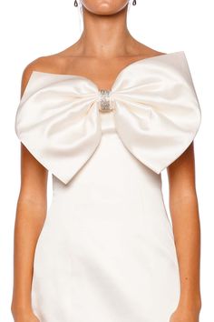 This strapless mini dress features a statement-making oversized bow detail with crystal embellishments at the center bodice. Back zip fastening Slim fit 60% polyester, 40% silk Dry clean only Bow Mini Dress, Strapless Mini Dress, Crystal Embellishment, White Mini Dress, Bow Detail, Dresses For Sale, Bodice, Embellishments, Full Length