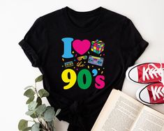 This t-shirt is the perfect choice for anyone attending an 90s-themed party or event. The shirt features a crew neck and short sleeves, making it a comfortable option for any occasion. The graphic tee design showcases the phrase "This Is My 90s Costume" in a fun and festive font. Made from soft and durable cotton jersey fabric, this regular fit t-shirt is machine washable for easy care. Whether you're dressing up for a wedding, party, or simply casual wear, this t-shirt will be a hit. So channel your inner 90s vibe and make a statement with this must-have piece. Size Chart is given in the listing pictures! Washing Care  Wash your garment inside out at low temperature (30 degrees) and always wash with cold water. Do not tumble dry or iron on the print.  Service We take pride in our work and 1980s Fancy Dress, 90s Costume, 80s Costume, Graphic Tee Design, Retro Shirts, Showcase Design, Themed Party, Dress Summer, Summer Top