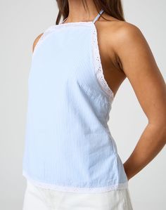 This blouse features a high neck halter design with a detailed tie back for an adjustable fit to your tailored desire. Backless Summer Tops For Day Out, Chic Cotton Blouse With Tie Back, Chic Stretch Camisole For Daywear, Chic Stretch Cami Blouse, Fitted Cami Blouse For Daywear, Fitted Halter Neck Lace Top, Halter Neck Blouse For The Beach, Halter Neck Blouse For Beach, Elegant Spring Camisole Halter Top