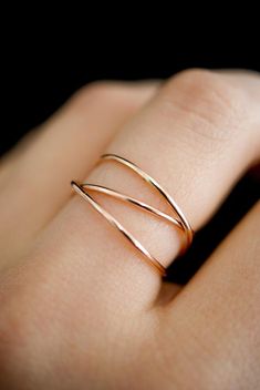 This item is made to order and will ship after 7-10 business days. That time does not include holidays, weekends or shipping time!This is a gorgeous ring made of 14K Rose Gold-fill metal. We wrap a length of 14K Rose Gold-fill around three times and securely solder it around back. Then the ring is either hammered for a reflective shine or left with the original smooth, rounded finish.The beauty of this ring lies in its organic shape. We can never create the same wrapped effect twice, which means Rose Gold Statement Ring, Rose Gold Rings Simple Unique, Gold Wrap Ring, Jewelry Hacks, Dream Ideas, Fav Products, Criss Cross Ring, Woven Ring, Products Photography