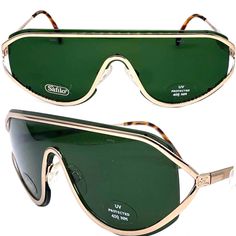 Safilo Emozioni 349/S occhiali da sole a fascia/scudo Fatto a mano in Italia negli anni '80. Design modernista e alla moda in metallo dorato con lenti a scudo tutto in uno e sulla parte superiore struttura in metallo con aste abbinate. Nuovo e mai indossato da deadstock in ottime condizioni Misure Aste 13,5 cm Ponte 1,5 cm totale 14,5cm Vintage Aviator Shield Sunglasses With Uva Protection, Retro Cat Eye Shield Sunglasses With Uv Protection, Retro Shield Sunglasses With Uva Protection, Retro Cat Eye Shield Sunglasses For Summer, Retro Aviator Shield Sunglasses With Tinted Lenses, Vintage Polarized Shield Sunglasses For Summer, Retro Shield Sunglasses With Uv Protection, Retro Shield Sunglasses With Mirrored Lenses, Retro Shield Sunglasses With Anti-reflective Coating