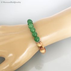 "❖ GREEN JADE: Natural 8mm gemstone ❖ ♥ Stability ♥ Longevity ♥ Fertility ♥ Serenity ♥ Wisdom ♥ Practicality ♥ Tranquility ♥ Balance ♥ Peace ♥ Harmony ♥ Moderation ♥ Perspective ❖ CEDAR WOOD: Natural 8mm wooden beads ❖ ♥ Strength ♥ Purification ♥ Spiritual protection ♥ Healing ❖ SPACERS: Antique pewter charms made in USA. ❖ Durable Elastic Stretch Cord. ❖ The gemstones are natural, so you may see some variations. ❖ Your purchase will arrive attractively packaged and ready to give. ❖ Size ❖ Women Green Jade 8mm Beads Jewelry, Green Jade Jewelry With 8mm Beads, Green Jade Jewelry For Meditation, Everyday Green Jade Beaded Bracelets, Green Stretch Bracelet For Meditation, Adjustable Green Stretch Bracelet For Meditation, Holistic Hand-strung Jade Jewelry, Green Adjustable Stretch Bracelet For Meditation, Green Jade Stretch Bracelet For Meditation