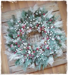 a christmas wreath on top of a wooden table