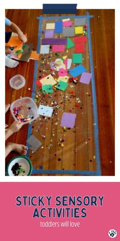 children are playing with colorful paper on the floor