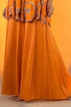 Orange spaghetti strap sleeves kurta with flora cutwork embroidery on the hem using sequin, bead highlights. Paired with a flared sharara. - Aza Fashions Flared Sharara, Orange Spaghetti, Kurta With Sharara, Orange Satin, Cutwork Embroidery, Women Kurta, Cut Work, Aza Fashion, Square Neck