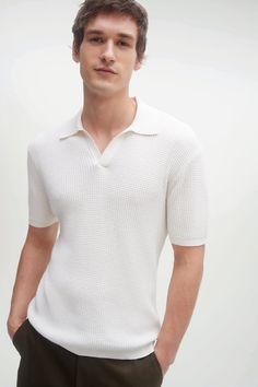 The Chase offers both comfort and style, featuring a thermal stitch and polo collar. 243 grams of cotton cashmere in 14-gauge knit Malano polo collar Short sleeve Thermal stitch 85% Cotton 15% Cashmere 27" length (size large) Hand Wash Cold or Dry Clean All sale items are FINAL SALE. Ribbed Knit Collared Polo Shirt, Ribbed Knit Polo Sweater With Polo Collar, Textured Knit Collared Polo Shirt, Classic Textured Knit Polo Shirt With Collar, Ribbed Cotton Collared Polo Shirt, Textured Knit Polo Sweater With Collared Neckline, Collared Textured Knit Polo Sweater, White Textured Knit Casual Polo Sweater, Casual White Textured Knit Polo Sweater