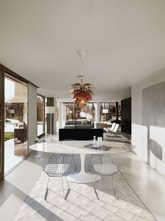 an open living room and dining area with sliding glass doors