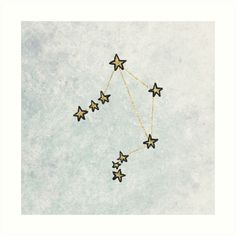 five stars hanging from the side of a white wall with gold chains on it, against a pale blue background