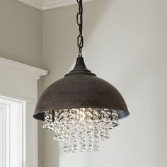 a chandelier hanging from the ceiling in a room