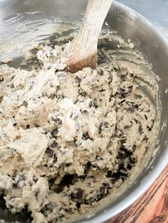 a mixing bowl filled with batter and chocolate chips