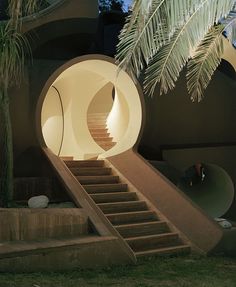 an outdoor area with stairs and palm trees