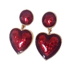 Red Heart Drop Earrings These Red Heart Stud Drop Earrings will add a touch of glamour to your look. Red stones and gold casing, these earrings are perfect for making a statement. With a length of 4.5cm and width of 2.5cm, they are the perfect size to make an impact. Wear with the FITZ Creative 'Selena Inspired Red Jewelled Bustier and Leggings' for a show-stopping look. Elegant Red Double Heart Earrings, Glamorous Heart Drop Earrings For Valentine's Day, Red Heart Charm Earrings For Party, Red Double Heart Earrings For Party, Red Heart Charm Metal Earrings, Red Heart-shaped Metal Earrings, Glamorous Heart Shaped Earrings For Valentine's Day, Glamorous Heart-shaped Earrings For Valentine's Day, Red Metal Heart Earrings For Party