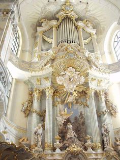 an ornately decorated organ in a church