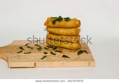 some food is stacked on top of each other and ready to be cut into pieces