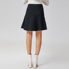 This minimalist short skirt features an adjusted cut on the hips and a flared yoke down to the hem. To wear with the associated jacket: an ensemble that is suitable for professional or semi-formal occasions, for a polished look and a refined style. Main material: 55% Polyester, 45% Wool. Lining: 95% Polyester, 5% Elastane.  Washing temperature 30° maximum in delicate cycle. Low ironing temperature / bleaching prohibited. Do not tumble dry. Modern A-line Skirt For Workwear, Fitted A-line Mini Skirt, Chic Flared Mini Skirt For Office, Workwear Mini Skirt With Pleated Hem, Fitted Flare Skirt In Solid Color, Solid Fitted Flare Skirt, Solid Flared Fitted Skirt, Solid Color Fitted Flare Skirt, Fitted A-line Skort