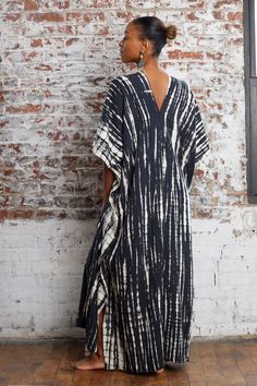 "Tie Dye Kaftan Dress in elegant Black, your go-to outfit for vacations, beach days, cruises, staycations, and lounging in style. Our black tie-dye kaftan dress is designed with both comfort and style in mind. Its loose, flowy silhouette provides ample room for your growing bump while keeping you effortlessly chic. Its timeless tie-dye pattern and relaxed fit make it an ideal choice for strolling through picturesque destinations, sipping cocktails by the pool, or exploring local markets. Versati Long Dress With Side Slits For Vacation, Unlined Relaxed Fit Midi Dress For Vacation, Bohemian Relaxed Fit Unlined Dress, Relaxed Fit Unlined Dress For Vacation, Unlined Relaxed Fit Dress For Vacation, Cotton Vacation Dresses Unlined, Relaxed Fit Tunic Dress Unlined, Long Unlined Summer Dresses, Long Relaxed Fit Vacation Dress