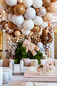 a room filled with lots of balloons and furniture