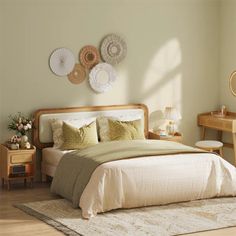 a bed sitting in a bedroom next to a wooden dresser and table with two lamps on it