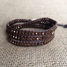 "This is a beautiful brown Bohemian beaded wrap bracelet and it would make the perfect Valentines Day gift for that special person in your life. If you're looking for a brown wrap bracelet to complete your favorite outfit you can't go wrong with this wrap bracelet. It is comfortable enough to wear all day at work and leave it on for a night out. You'll never want to take it off. This wrap bracelet is made with top quality leather cord and Czech glass beads in dark bronze. This bracelet measures Beaded Brown Friendship Bracelets As Gift, Brown Beaded Friendship Bracelets As Gift, Spiritual Brown Friendship Bracelets For Festivals, Adjustable Brown Beaded Wrap Bracelet, Brown Beaded Round Bead Friendship Bracelets, Brown Beaded Friendship Bracelets With Round Beads, Brown Beaded Spiritual Friendship Bracelets, Hand Wrapped Brown Beaded Bracelets As Gift, Brown Beaded Friendship Bracelets