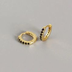 14k Yellow Gold & Black Cz Paved Huggie Hoop Earrings Price Is For 1 Pair (2 Pieces) Stone(S) Details: Stones: 11 Cz Gemstones Each (22 In Total) Stone Type: Cubic Zirconium Stone Color: Black Stone Shape: Round Stone Size: 1.5mm (Each) Stone Setting: Hand-Set Metal Details: Metal Type: Sterling Silver Metal Color: Yellow Gold Metal Finish: Beautifully Polished Karat: 14k Earring Design Details: Earring Style: Huggie Hoop Earring Back: Hinged Inner Diameter: 7mm Outer Diameter: 10mm Dainty Hoop Earrings, Sterling Silver Hoop Earrings, Huggie Earrings, Delicate Earrings, Huggie Hoop Earrings, Hoop Earrings Small, Stunning Jewellery, Sterling Silver Hoops, 925 Sterling Silver Earrings