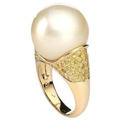 Ring in 18kt yellow gold set with one pearl 16.50 mm and yellow diamonds 1.04 cts Size 52           Total weight: 14.49 grams Luxury Gold Pearl Ring With High Luster, Luxury High Luster Gold Pearl Ring, Luxury Gold Pearl Ring, Luxury Pear-shaped Yellow Gold Rings, Diamond Bracelet Design, Yellow Diamonds, Pearl And Diamond Ring, Contemporary Ring, Bracelet Design