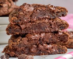 a stack of chocolate brownies sitting on top of each other