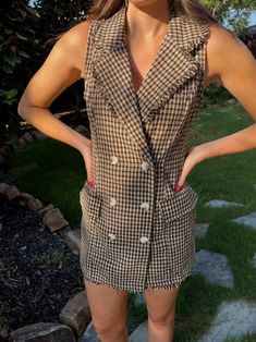 Step into fall with timeless elegance in our sleeveless plaid tweed dress, a perfect blend of brown and beige hues. This classic piece exudes sophistication and style, making it a must-have for any woman's wardrobe. The sleeveless design allows for easy layering, making this dress versatile for both casual and formal occasions. Embrace the chic vibes and embrace your inner fashion icon with this stunning plaid tweed dress. #FallFashion #TweedDress #SleevelessStyle #ClassicElegance #WomensBoutiqu Chic Houndstooth Tweed Dress For Fall, Chic Tweed Dress With Houndstooth Pattern For Fall, Chic Sleeveless Plaid Mini Dress, Brown Fitted Plaid Dress, Sleeveless Plaid Dress For Fall, Sleeveless Plaid Dress For Work, Fitted Brown Plaid Dress For Spring, Fitted Brown Plaid Dress, Chic Plaid Tweed Dress For Fall