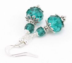 These Emerald Crystal Glass Beaded Earrings are striking and romantic!   💎 Earrings feature sparkly Emerald Faceted Crystal Glass beads. The large rondelle bead measures 12mm x 9mm. The smaller round bead measures 6mm.  💎 The beads are accented by finely-detailed filigree bead caps and spacer beads.  💎 Earring hooks are silver-plated, lead and nickel-free for sensitive ears.  💎 Earrings hang approximately 1.75 inches long.  Enjoy wearing these as a gift to yourself! Or give them as a gift to the Happy Girl in your life! Want to see more items like these? You can find many more styles like this in the Earrings Section of my shop: https://www.etsy.com/shop/SparklyBliss?section_id=15698941&ref=shopsection_leftnav_1 FREE Microfiber Jewelry Polishing Cloth with any purchase of $25.00 and ov Crystal Bead Earrings, Romantic Earrings, Emerald Crystal, Beaded Earrings Diy, Jewelry Summer, Handmade Glass Beads, Spring Jewelry, Handmade Jewelry Diy, Earrings Green