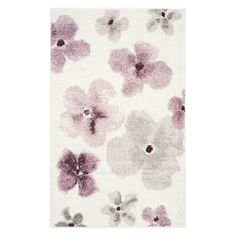 a white rug with purple flowers on it