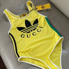 New Tag Xs Size Box Included Ship Fast Can Be Wear As A Top Or Body Suit From Boutique Gucci Swimwear For Summer, Gucci Beachwear Swimwear For Summer, Gucci Fitted Summer Swimwear, Gucci Beachwear For Summer, Denim Bodysuit, Gold Bodysuit, Embroidered Bodysuit, Gucci Top, Gucci T Shirt