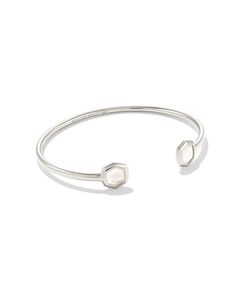 A minimalist pinch cuff bookended with our signature shell-inlaid shape, the Davis Sterling Silver Small Cuff Bracelet in Ivory Mother-of-Pearl is a stacking staple. No matter the size of your wrist, it’s sure to fit you and your one-of-a-kind style. Modern Adjustable Pearl Bracelet For Formal Occasions, Silver Collection, 2023 Christmas, Demi Fine Jewelry, Minimalist Bracelet, Genuine Turquoise, Pearl Size, Silver Earrings Studs, Kendra Scott