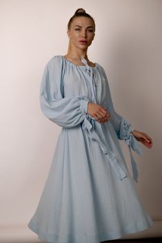 Indulge in timeless romance with our A-line midi dress featuring wide puffy sleeves, a captivating neckline, and a graceful long fabric belt. Crafted from soft cotton muslin, this enchanting piece is designed to elevate your elegance with every step. 💠 See other Products : https://www.etsy.com/de-en/shop/LuluComfort 📸 MODEL The model in the pictures is 164cm/5'3" tall and wears a size S; 📌 SIZES 💠 Available in a range of sizes to ensure the perfect fit for every body type: ➡️ XS: US 2 / UK 6 Spring Dresses For Brunch With Bishop Sleeves, Spring Brunch Dress With Bishop Sleeves, Spring Daywear Puff Sleeve Dress With Bishop Sleeves, Spring Puff Sleeve Dress With Bishop Sleeves For Daywear, Spring Daywear Midi Dress With Balloon Sleeves, Spring Midi Dress With Balloon Sleeves For Daywear, Spring Balloon Sleeve Midi Dress For Daywear, Spring Maxi Dress With Pleated Bishop Sleeves, Modest Midi-length Puff Sleeve Dress With Gathered Sleeves