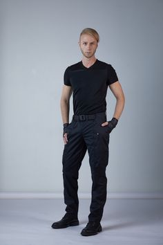 Cyberpunk cargo pants, black techwear pants made in Crease Resist cotton and viscose fabrics. The pants design is a blend of jodhpur and cargo pants. Extra volume on the sides is used for pockets. The pants have 4 pockets. There is one zippered and one open pocket on the front. The same pockets form a very long pocket underneath it that has a less deep pocket inside. The long pockets are 40-45 cm / 15'' 6/8 - 17'' 6/8 deep. Zippered pocket has a molded plastic zippers which have a longer life co Black Combat Straight Leg Pants, Black Combat Pants With Straight Leg, Functional Straight Leg Fitted Cargo Pants, Fitted Black Cargo Pants For Outdoor, Fitted Outdoor Techwear Pants, Fitted Techwear Pants For Outdoor, Techwear Parachute Pants With Tapered Leg, Black Techwear Work Pants With Multiple Pockets, Fitted Techwear Cargo Pants With Multiple Pockets