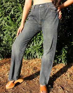 Vintage 501 Levi's in a faded blue denim. High rise. Button fly. Front and back pockets. Straight leg. UK 16 / Eur 46 Actual measurements - 34"(86cm) waist - 42"(107cm) hips - 31"(86cm) inner leg - 11"(28cm). Material - Denim. Condition - Good, small wear next to zipper, reflected in our price. Handpicked, repaired and ready to wear. This is an original vintage item, not new and minor signs of wear & age are expected, we will highlight any major flaws. Model is a UK 6/8 and is 5'7" tall Levi's Faded Straight Leg Bottoms, Vintage Stonewashed Relaxed Fit Bottoms, Levi's Faded Denim Bottoms, Faded Levi's Denim Bottoms, Levi's Faded Straight Leg Jeans, Levi's Vintage Medium Wash Jeans, Vintage Levi's Medium Wash Jeans, Vintage Stonewashed Denim Bottoms, Levi's Vintage Faded Bottoms