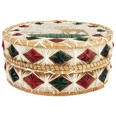 three woven baskets stacked on top of each other in different colors and patterns, one is red, the other is green