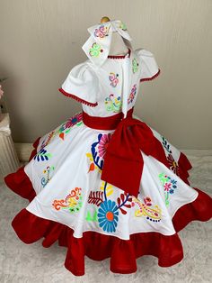 This beautiful dress resembles the escaramuza girls from Mexico. It is also calle charro dress. Is it beautiful, the detail on it is a work of art. All the embroidery is specially designed. I choose this colors because that how the customer wanted, but keep in mind it is made by order. That meant I can customize it however you want. Any color you choose I'll be happy to make it perfect for you. The dress is one piece but I also include a tulle underskirt to make it full but confortable I case th Traditional White Dress With Ruffles, Traditional White Costume Dress, White Dresses For Cinco De Mayo Fiesta, Red Dress For Cinco De Mayo Fiesta, Fiesta Dresses With Ruffles, Traditional Ruffle Dress For Fiesta, Ruffled Dresses For Fiesta, Mexican Dresses For Kids, Escaramuza Dress