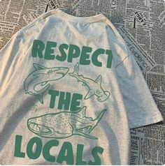 Wearing a "Respect the Locals" shirt isn't just about making a fashion statement--it's a way to honor the natural world and the communities that rely on it. These shirts feature a vibrant designs inspired by marine life, capturing the beauty and diversity of our oceans. But beyond the aesthetics, they carry a deeper message of environmental stewardship and cultural appreciation. By sporting this shirt, you're not only showcasing your love for marine ecosystems but also advocating for their prote Cultural Appreciation, Respect The Locals, Environmental Stewardship, Tread Lightly, Loose Tees, Sustainable Practices, Marine Animals, Coastal Towns, Design Lab