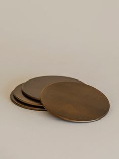 three brown plates sitting on top of each other