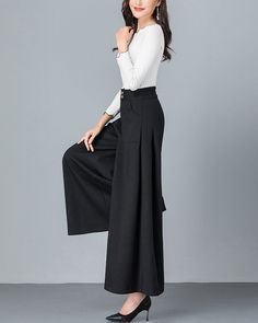 * A cool wide leg skirt pants, made of quality cotton blends. * Two pockets, they are big enough for your hands. * Fixed waist on front and elastic waist on back. * Material: 6% cotton, 90% polyester, 4% spandex * Let us know your usual size in your country and your overall height. * Can custom make waist size and length. * Size: True to US size, US 0-US 20 are available, you can let us know your usual size and height in your order. * Shipping: Free shipping Processing time : 5-7 Business days D Black Cotton Wide Leg Culottes, Black Wide Leg Cotton Culottes, High-waisted Culottes With Pockets For Fall, Casual Wide Hem Bottoms For Work, Casual Workwear Bottoms With Wide Hem, Wide Leg Culottes With Pockets, Fall High-waisted Culottes With Pockets, High-waist Baggy Cotton Culottes, Wide-leg Culottes For Fall