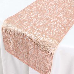 an image of a table setting with white linens and pink lace on the edge