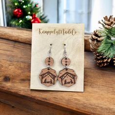 Beautiful wood engraved nativity Christmas earrings  These are lightweight. The pendant measures 1.75 inches long. A perfect length for most!  Each earring is engraved, then laser cut into the two different shapes for a unique finish Handmade with hypoallergenic hardware with three different color options-  Silver , Bronze , & Rose Gold  These are perfect for all book lovers!  Great gift for birthdays, moms, teachers, daughters, wives.  *Please message me with any questions/ concerns! I will be Nativity Earrings, Christian Earrings, Engraved Earrings, Nativity Christmas, Earrings Wood, Earrings Christmas, Christmas Nativity, Christmas Earrings, Wood Earrings