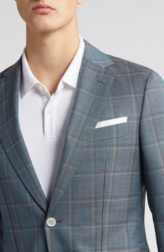 A smart plaid patterns a sport coat tailored from virgin wool and framed with notched lapels for timeless sophistication. 29 1/2" length (size 42R) Notched lapels Nonfunctional four-button cuffs Chest welt pocket; front flap pockets Side vents Partially lined, with taped seams 100% virgin wool Dry Clean Made in Turkey Hugo Boss/BOSS/HUGO has received the Fair Labor Association accreditation, which signifies that the company has effective systems and procedures in place to successfully uphold fai