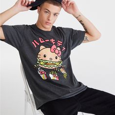 The Iconic Hello Kitty Takes On A Unique Fast Food Form On The Front Of This Fun Tee. Knit Fabric Hello Kitty Burger, Shake, Fries & Ice Cream Graphic Unisex Fit Crew Neck 50% Cotton, 50% Polyester Machine Wash/Dry Casual Cat Print Tops For Streetwear, Cute Hello Kitty Tops For Streetwear, Hello Kitty Print Tops For Spring Streetwear, Kawaii Relaxed Fit Tops For Streetwear, Hello Kitty Print Crew Neck Top For Streetwear, Casual Hello Kitty Crew Neck Top, Casual Cotton T-shirt With Hello Kitty Print, Fitted Cotton T-shirt With Hello Kitty, Casual Black Hello Kitty Top