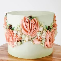 a close up of a cake on a wooden table