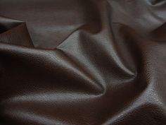 a close up view of a brown leather textured material that is very soft and smooth